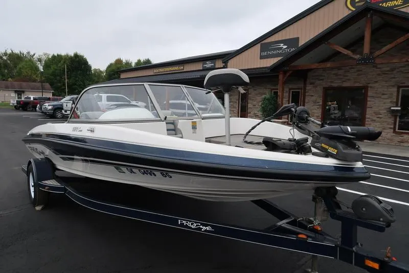 Slide: The Image of 2005 ProCraft 181 Combo boat on trailer outside a marine dealership. - 16