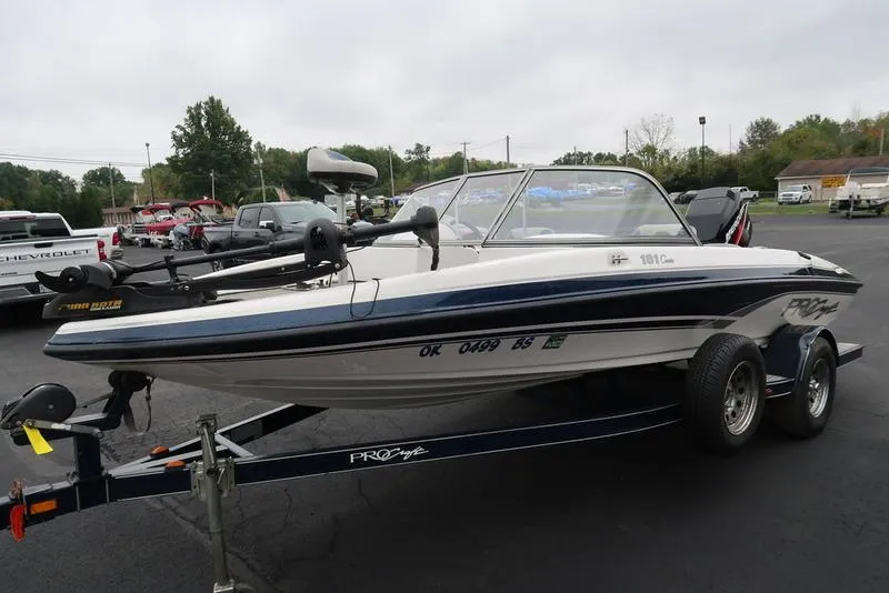 Slide: The Image of 2005 ProCraft 181 Combo boat on trailer in parking lot. - 2