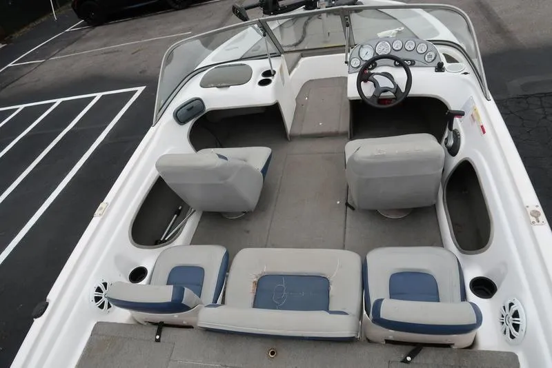 Slide: The Image of 2005 ProCraft 181 Combo boat interior with seating and dashboard view. - 20