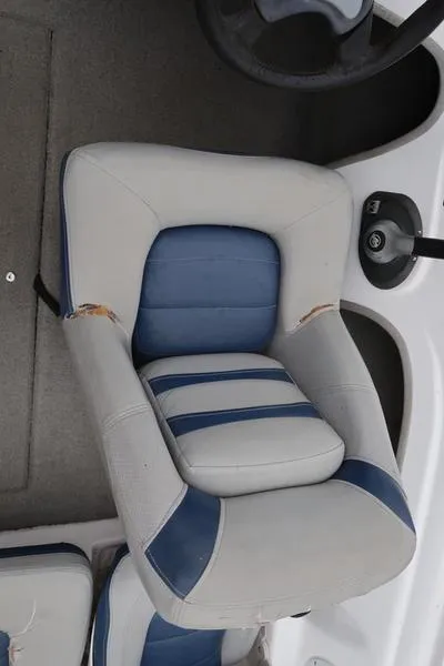 Slide: The Image of 2005 ProCraft 181 Combo boat seat with blue and white upholstery. - 22