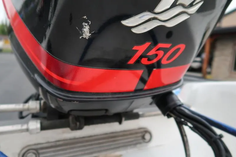 Slide: The Image of Close-up of a 2005 ProCraft 181 Combo boat engine with "150" decal. - 24