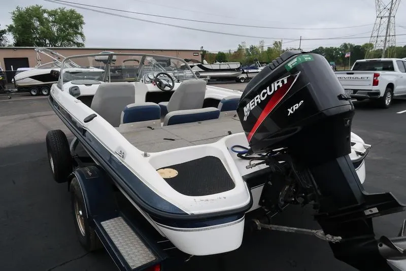 Slide: The Image of 2005 ProCraft 181 Combo boat with Mercury engine, parked on a trailer. - 6