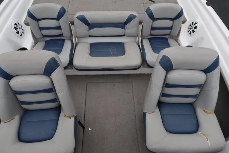 Slide: The Image of 2005 ProCraft 181 Combo boat interior with five blue and gray seats. - 8