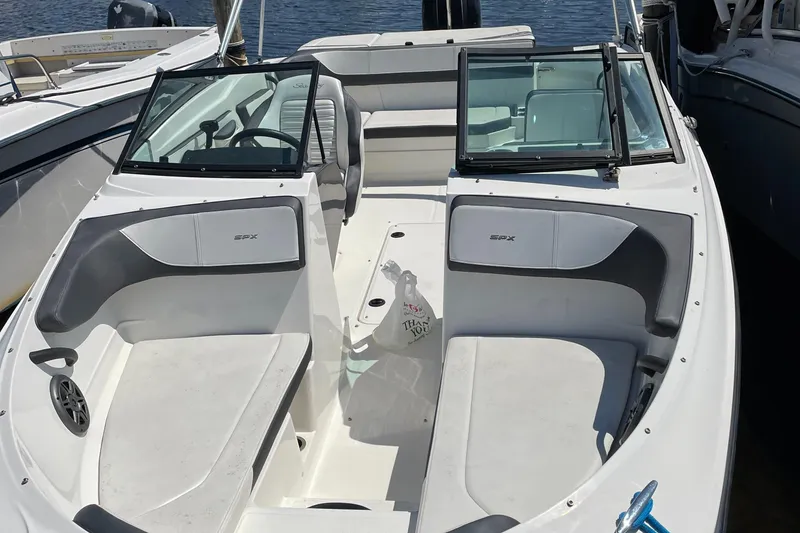 Slide: The Image of 2016 Sea Ray 21SPX-OB boat with open bow seating, docked on water. - 5