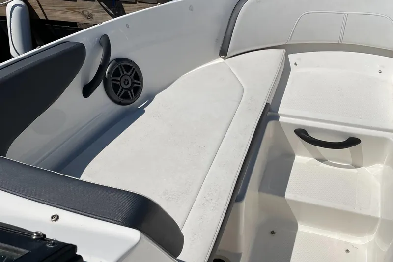 Slide: The Image of 2016 Sea Ray 21SPX-OB boat interior with seating and speaker detail. - 8