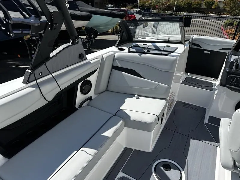 Slide: The Image of 2025 Axis T250 boat interior with white seating and modern design. - 7