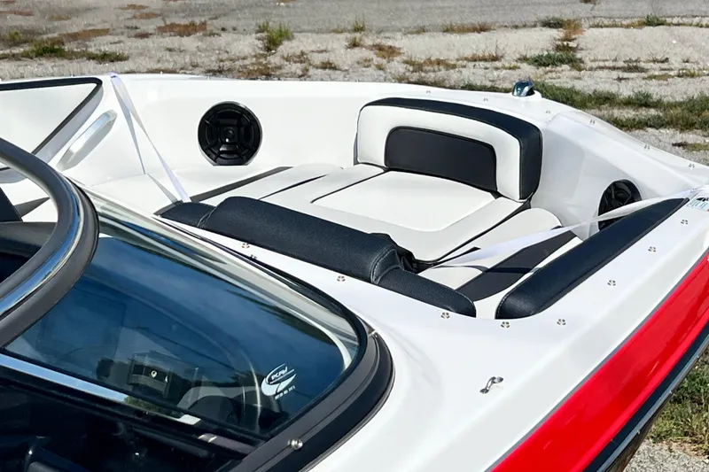 Slide: The Image of 2021 Yamaha Boats SX195 interior with white and black seating, sleek design, and speaker system. - 8