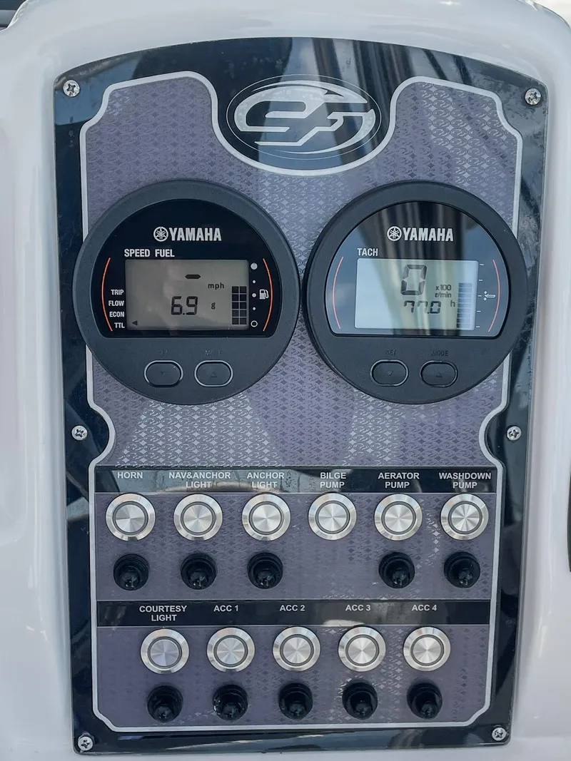 Slide: The Image of 2024 Sea Fox 228 Traveler dashboard with Yamaha gauges and control switches. - 16