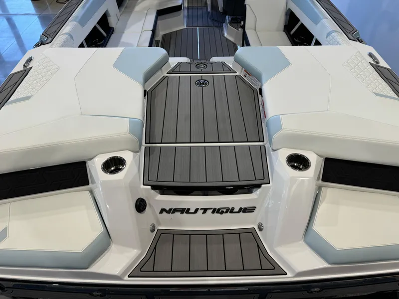 Slide: The Image of 2025 Nautique Super Air Nautique GS22 boat interior with sleek seating and modern design. - 10