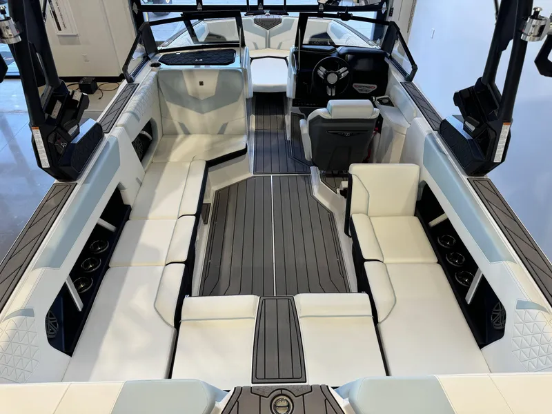Slide: The Image of 2025 Nautique Super Air Nautique GS22 interior with sleek seating and modern design. - 13