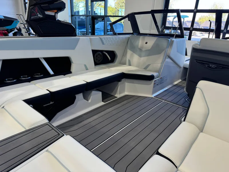 Slide: The Image of 2025 Nautique Super Air Nautique GS22 interior with sleek seating and modern design. - 14