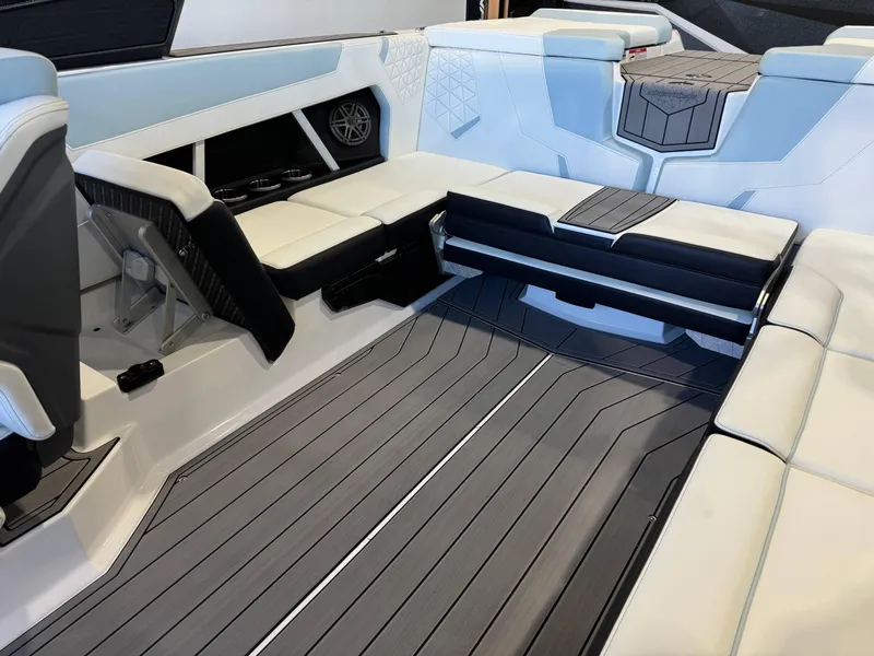 Slide: The Image of 2025 Nautique Super Air Nautique GS22 interior with sleek seating and modern design. - 15