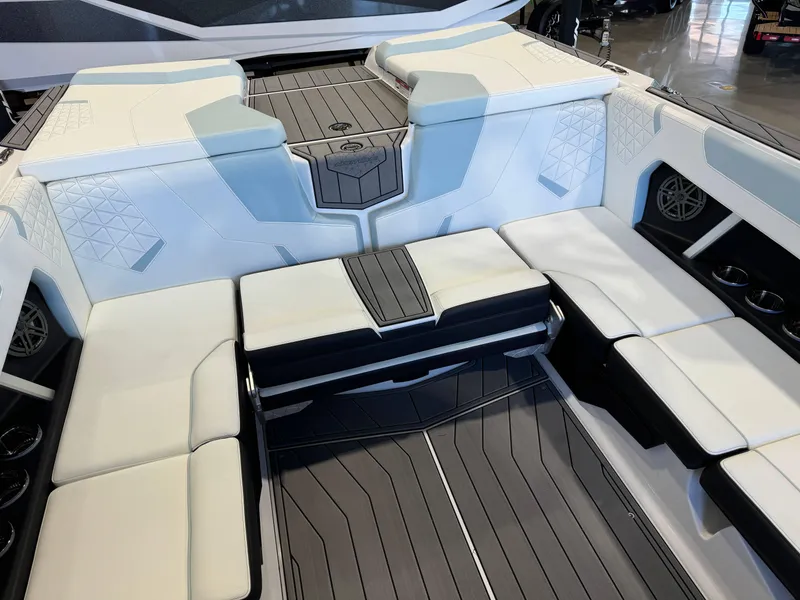 Slide: The Image of 2025 Nautique Super Air Nautique GS22 interior with sleek seating and modern design. - 16