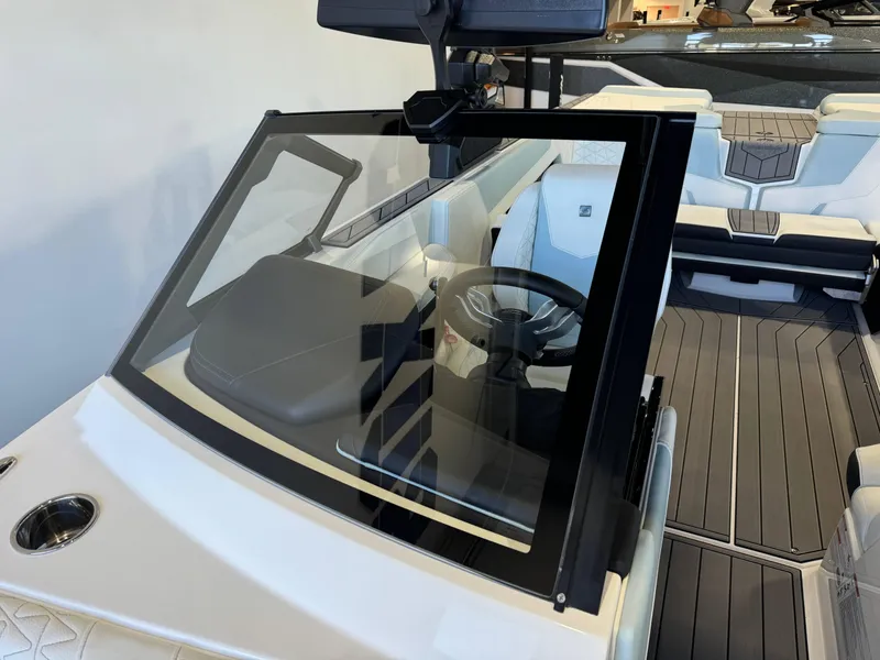 Slide: The Image of 2025 Nautique Super Air Nautique GS22 interior with sleek design and modern dashboard. - 20