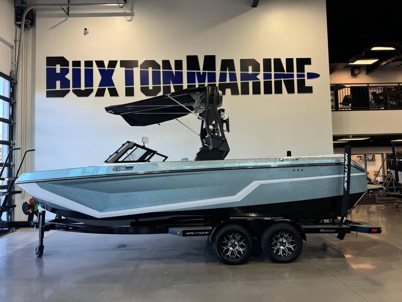 Slide: The Image of 2025 Nautique Super Air Nautique GS22 boat displayed at Buxton Marine showroom. - 4