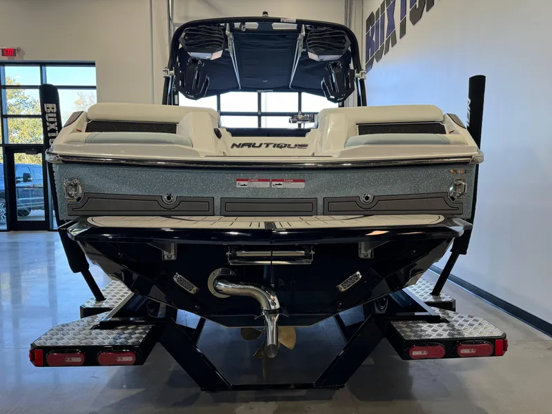 Slide: The Image of 2025 Nautique Super Air Nautique GS22 boat on trailer in showroom. - 6