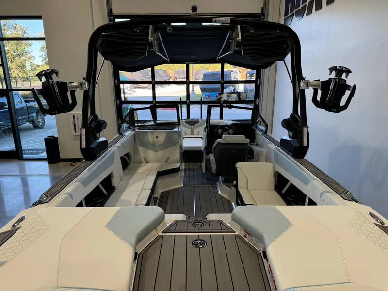 Slide: The Image of 2025 Nautique Super Air Nautique GS22 interior, showcasing sleek seating and advanced features. - 9
