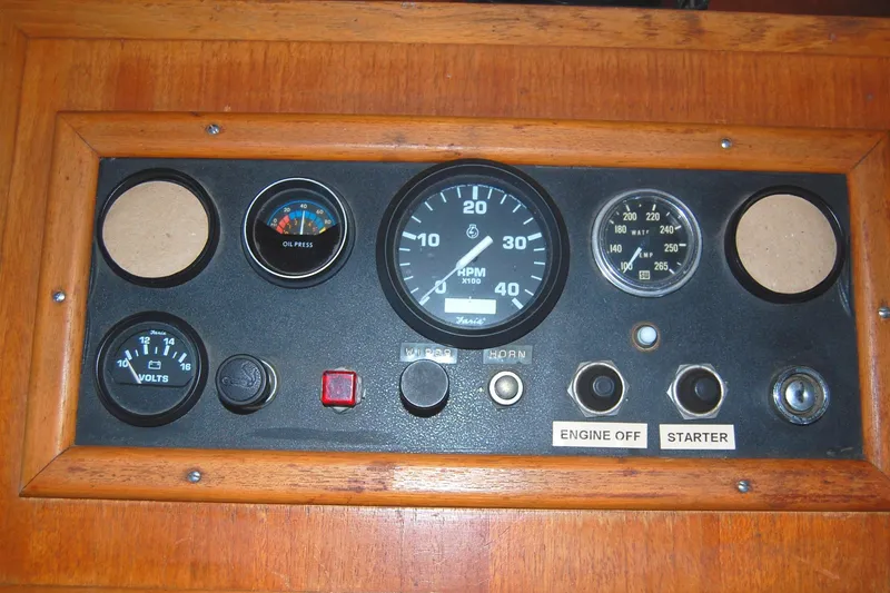 Slide: The Image of Control panel of 1985 Sundowner Tug Princess Louisa with gauges and switches. - 25