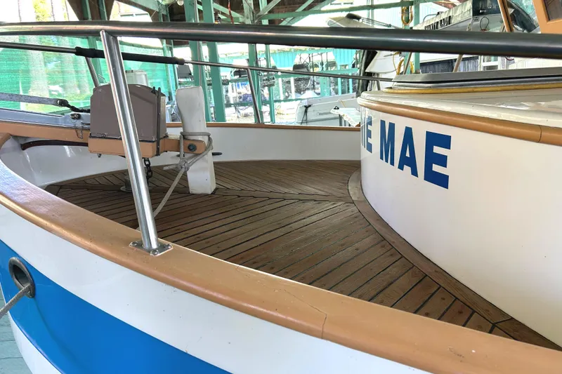 Slide: The Image of 1985 Sundowner Tug Princess Louisa boat deck with wooden flooring and railing. - 39