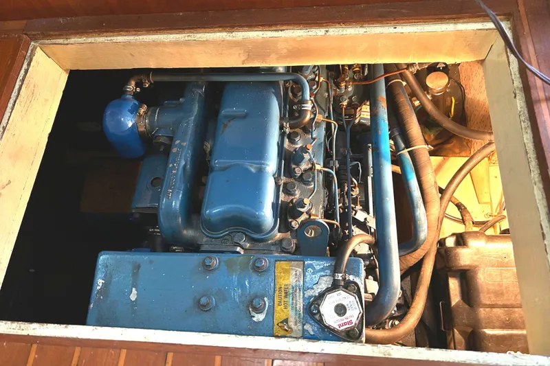 Slide: The Image of Engine compartment of 1985 Sundowner Tug Princess Louisa, showcasing blue machinery and components. - 40