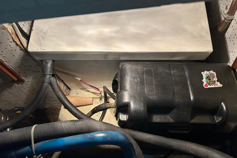 Slide: The Image of Engine compartment of 1985 Sundowner Tug Princess Louisa, showing cables and components. - 41