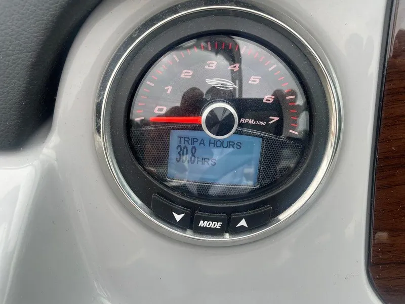 Slide: The Image of Dashboard of 2023 Chaparral 21 SSi showing RPM gauge and trip hours. - 15