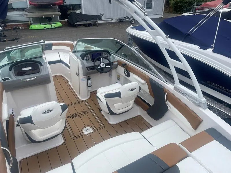 Slide: The Image of 2023 Chaparral 21 SSi boat interior with modern seating and sleek design. - 19