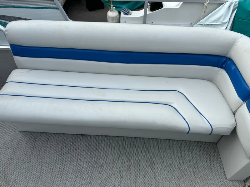 Slide: The Image of 1992 Harris FloteBote 240 Classic boat seat with blue and white upholstery. - 7
