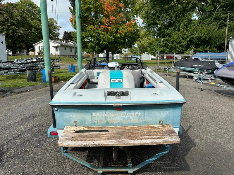 Slide: The Image of 1989 MasterCraft ProStar 190 boat, rear view, parked outdoors on a sunny day. - 1