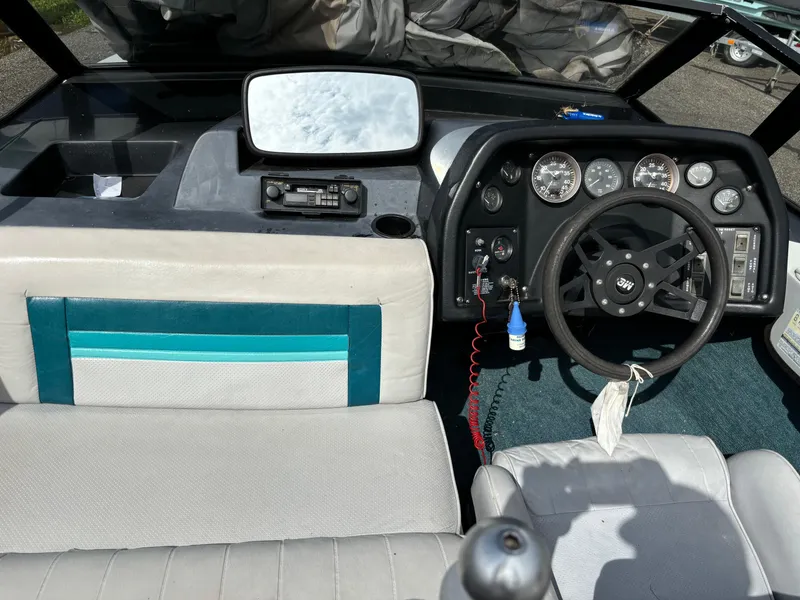 Slide: The Image of 1989 MasterCraft ProStar 190 boat interior with steering wheel and dashboard controls. - 3