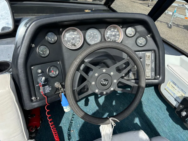 Slide: The Image of 1989 MasterCraft ProStar 190 dashboard with steering wheel and gauges. - 4