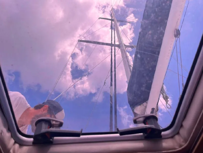 Slide: The Image of View from Irwin 54 sailboat hatch, showing mast and sky, 1990 model. - 10
