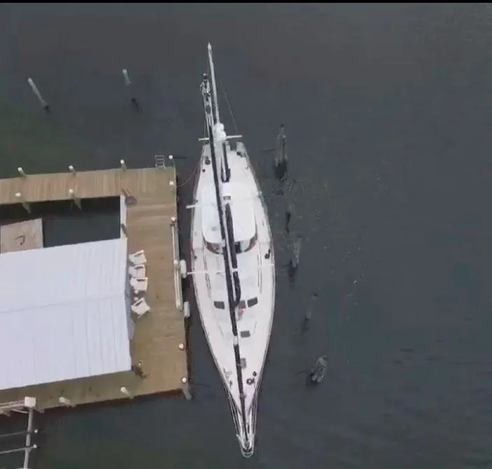 Slide: The Image of Aerial view of 1990 Irwin 54 yacht docked at a wooden pier. - 21