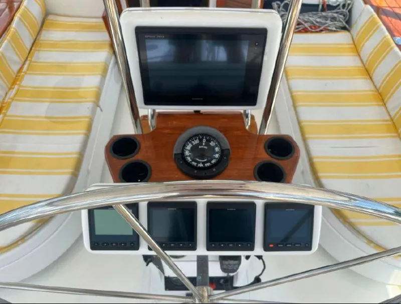 Slide: The Image of Cockpit of 1990 Irwin 54 sailboat with navigation instruments and compass. - 24