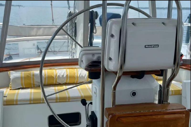 Slide: The Image of Irwin 54 sailboat cockpit with steering wheel and NavPod, 1990 model. - 25