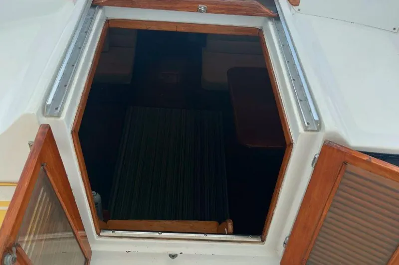 Slide: The Image of Open hatch of 1990 Irwin 54 sailboat, showing interior with wooden trim. - 27