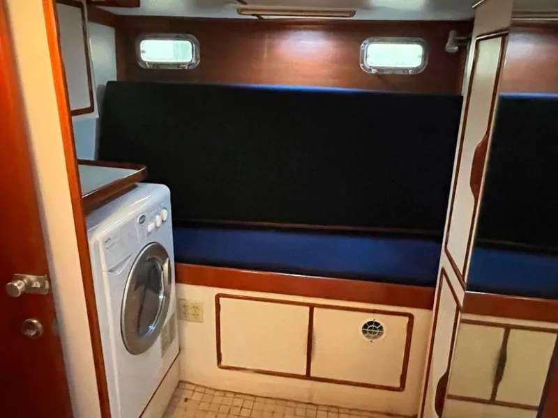 Slide: The Image of Interior of 1990 Irwin 54 yacht with seating and washing machine. - 33