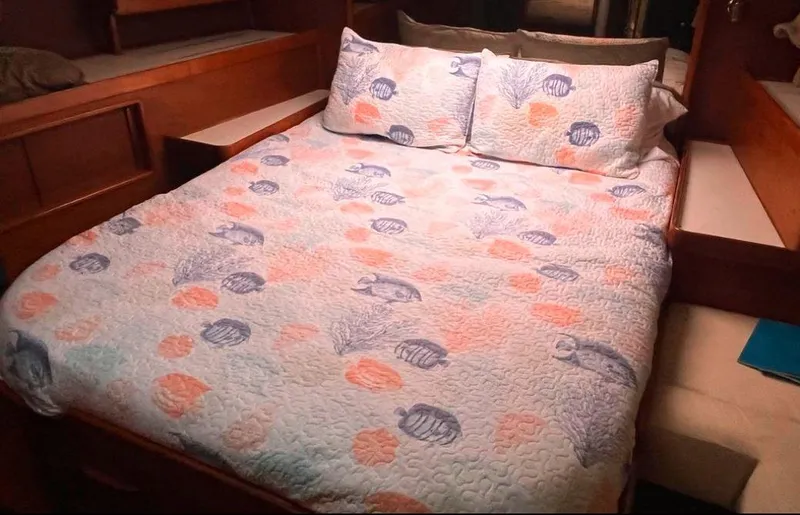 Slide: The Image of Cozy bedroom in 1990 Irwin 54 yacht with seashell-patterned bedding. - 37