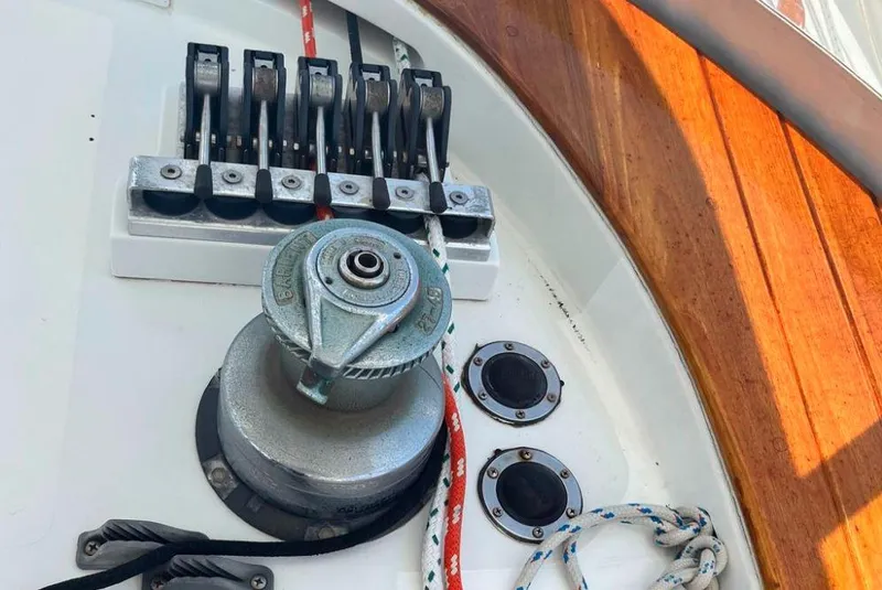 Slide: The Image of Sailing equipment on a 1990 Irwin 54 yacht deck, featuring winch and rope clutches. - 41