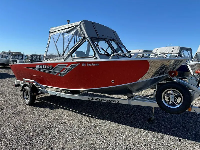 The Image of 2025 Hewescraft 200 Sportsman boat in red on EZ Loader trailer. - 0