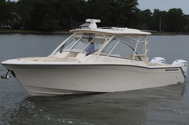 The Image of 2023 Grady-White Freedom 335 boat with dual outboard engines on display. - 0