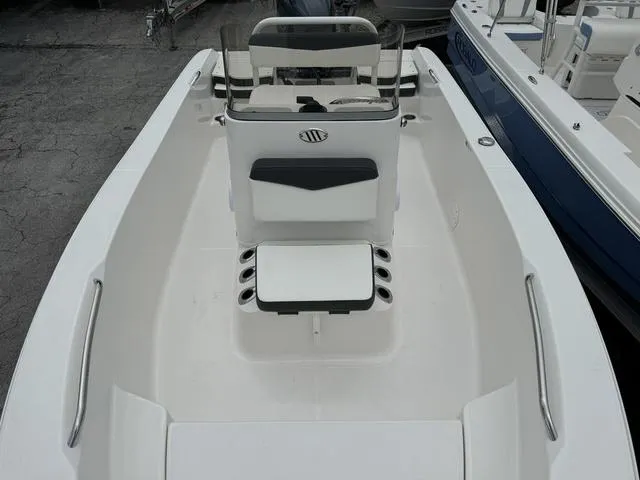 Slide: The Image of 2025 Robalo R160CC boat interior with center console and seating. - 10