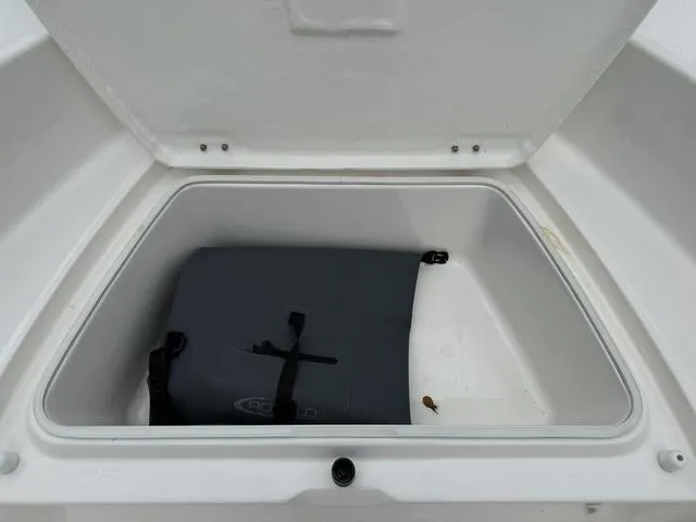 Slide: The Image of Open storage compartment in 2025 Robalo R160CC boat. - 9