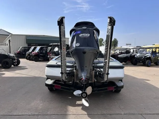 Slide: The Image of 2018 Skeeter ZX250 boat with powerful outboard motor, parked outdoors. - 10