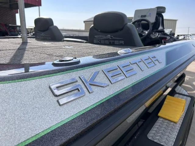 Slide: The Image of 2018 Skeeter ZX250 boat with sleek design and logo detail. - 12