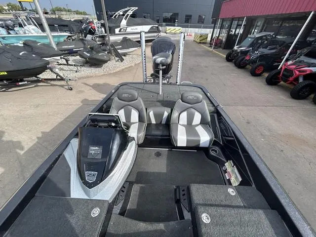 Slide: The Image of 2018 Skeeter ZX250 boat interior with seating and storage compartments. - 17