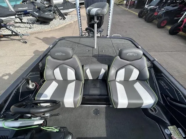 Slide: The Image of 2018 Skeeter ZX250 boat interior with dual seats and steering wheel. - 18