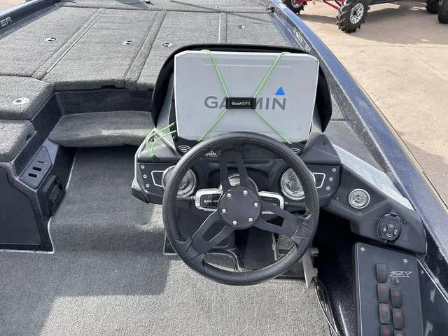 Slide: The Image of 2018 Skeeter ZX250 boat dashboard with Garmin navigation system. - 22