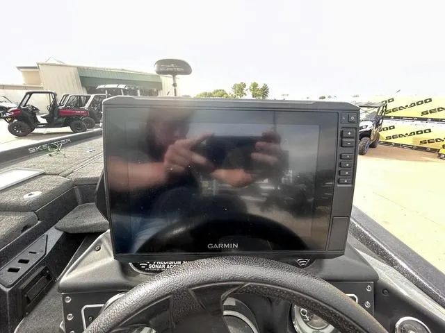 Slide: The Image of Garmin display on 2018 Skeeter ZX250 boat dashboard, outdoor setting. - 25