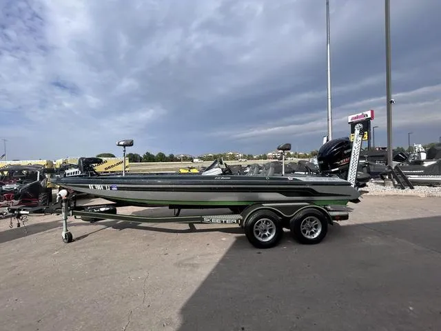 Slide: The Image of 2018 Skeeter ZX250 boat on trailer under cloudy sky. - 3